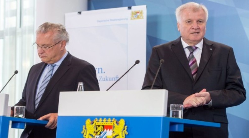 epa04970555 Interior Mininster of Bavaria Joachim Herrmann (L) and Bavarian Minister President Horst Seehofer attend a press conference in the context of a special meeting of the state cabinet in Munich, Germany, 09 October 2015. The government of the state of Bavaria is threatening to take Chancellor Angela Merkel to the top German court if she does not halt the mass flow of migrants into the country.  EPA/MATTIAS BALK