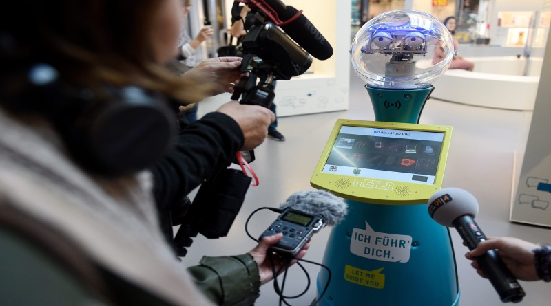 epa05622121 Tim, a robot that works in the Technology Museum of Berlin, guides visitors round the museum during a press conference at which the robot was unveiled in Berlin, Germany, 08 November 2016. The robot is to present and explain items in the museum's collection in future.  EPA/RAINER JENSEN