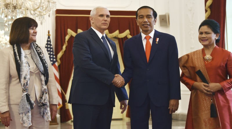 epa05916310 Indonesian President Joko Widodo (2-R) and first lady Iriana (R) greet US Vice President Mike Pence (2-L) and his wife Karen Batten (L) during their meeting at Merdeka Palace in Jakarta, Indonesia, 20 April 2017. Pence is currently on a 10-day trip in Asia.  EPA/BAY ISMOYO / POOL